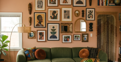 Modern Afrohemian living room with olive green curved sofa and eclectic gallery wall.