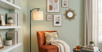 Modern luxury reading nook with orange velvet chair and minimalist decor for small apartments